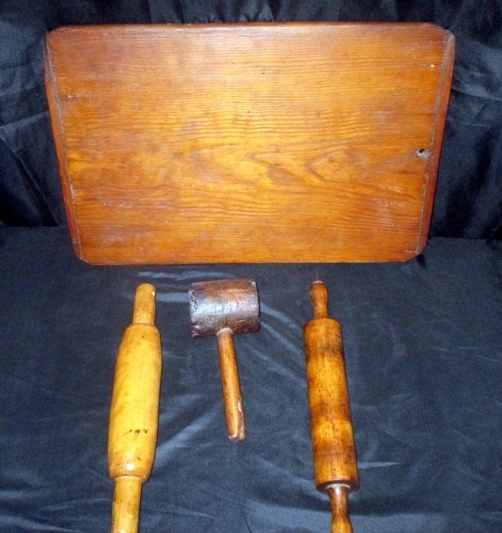 Collection of 4 Early Kitchen Collectibles: Primitive wooden kitchen items include breadboard 25.5" x 17", solid rolling pin 16.5", rolling pin 18.5" and mallet 10.5" L x 3.5" diameter.