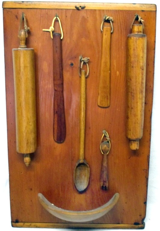 Collection of 7 Early Kitchen Collectibles: Primitive wooden kitchen items including bread board w/half bowl (28" x 17.5" wide), 2 rolling pins, spoon, 2 spatulas and decorator/crimper.