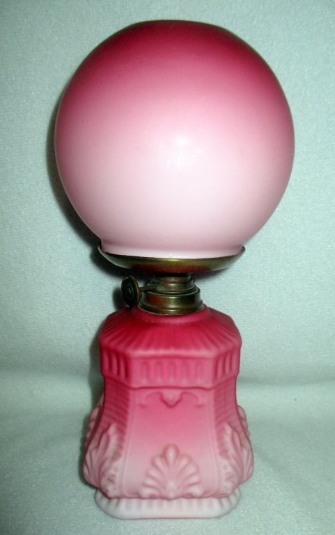 Miniature Cranberry Lamp: Satin shaded, cased white, ball shade & square base, Spar Brenner, overall 9" tall.