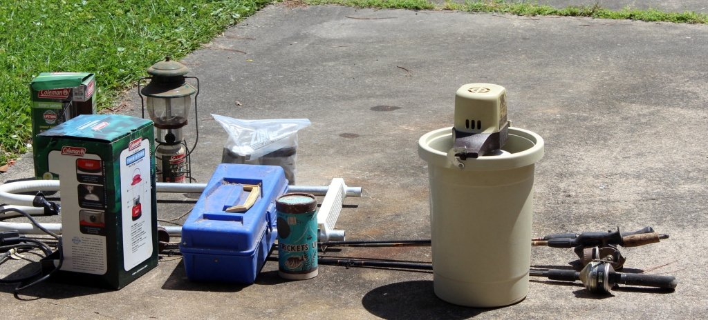 Camping & Fishing Gear: 3 fishing poles, 3 Coleman lanterns, ice cream maker, boat ladder, tackle box and cricket holder.