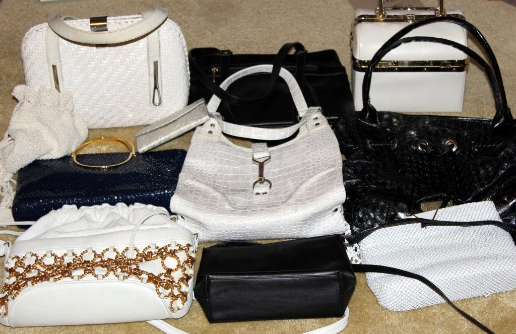 White & Black Purses: 10 bags, largest black marked Prada.
