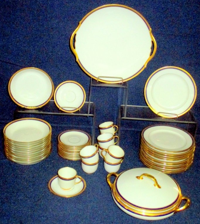 French Vignaud Limoges China: Including 11 demitasse saucers, 9 demitasse cups, twelve 6.25" diameter soup/cereal bowls, twelve 7.5" salad/dessert plates, 11.25" diameter double handled pastry plate together w/pattern matching cov