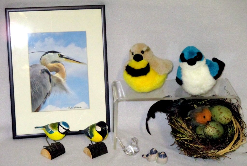 Collectible Bird Lot: Mixed materials including double Denmark ceramic birds, carved wood Wildlife Garden Blue Tit and Great Tit Deco Birds, Princess crystal bird, nest w/bird and eggs and 2 Audubon stuffed birds: Tree Swa