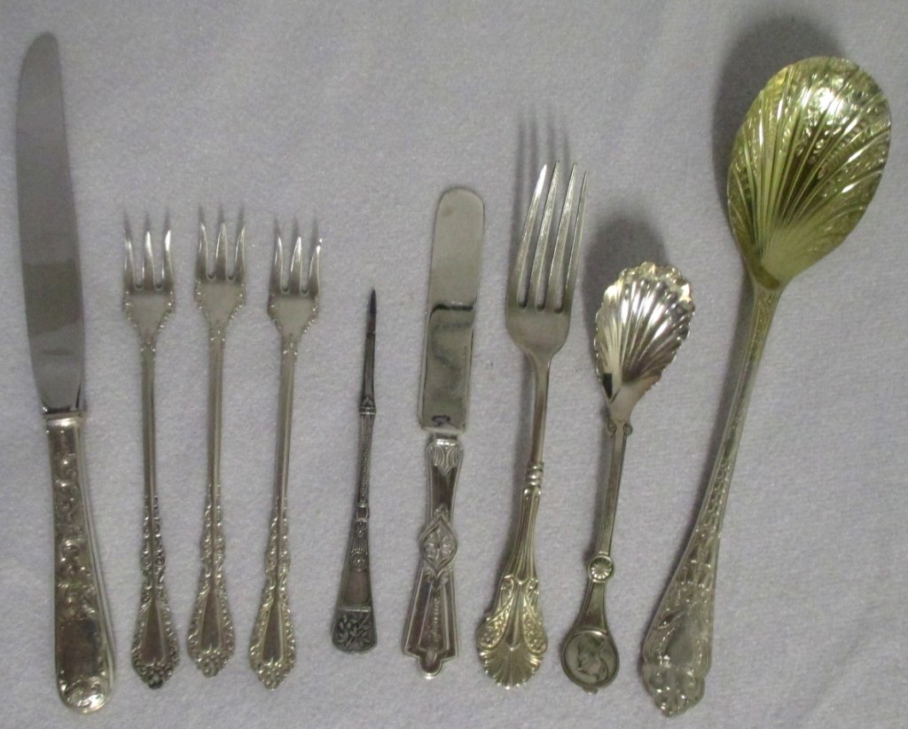 Sterling & Silverplate Flatware: Including sterling dinner fork & Kirk dinner knife; silverplate Reed & Barton sugar shell, youth knife, three cocktail forks, nut pick & Sheffield berry spoon. Sterling fork 1+ troy.