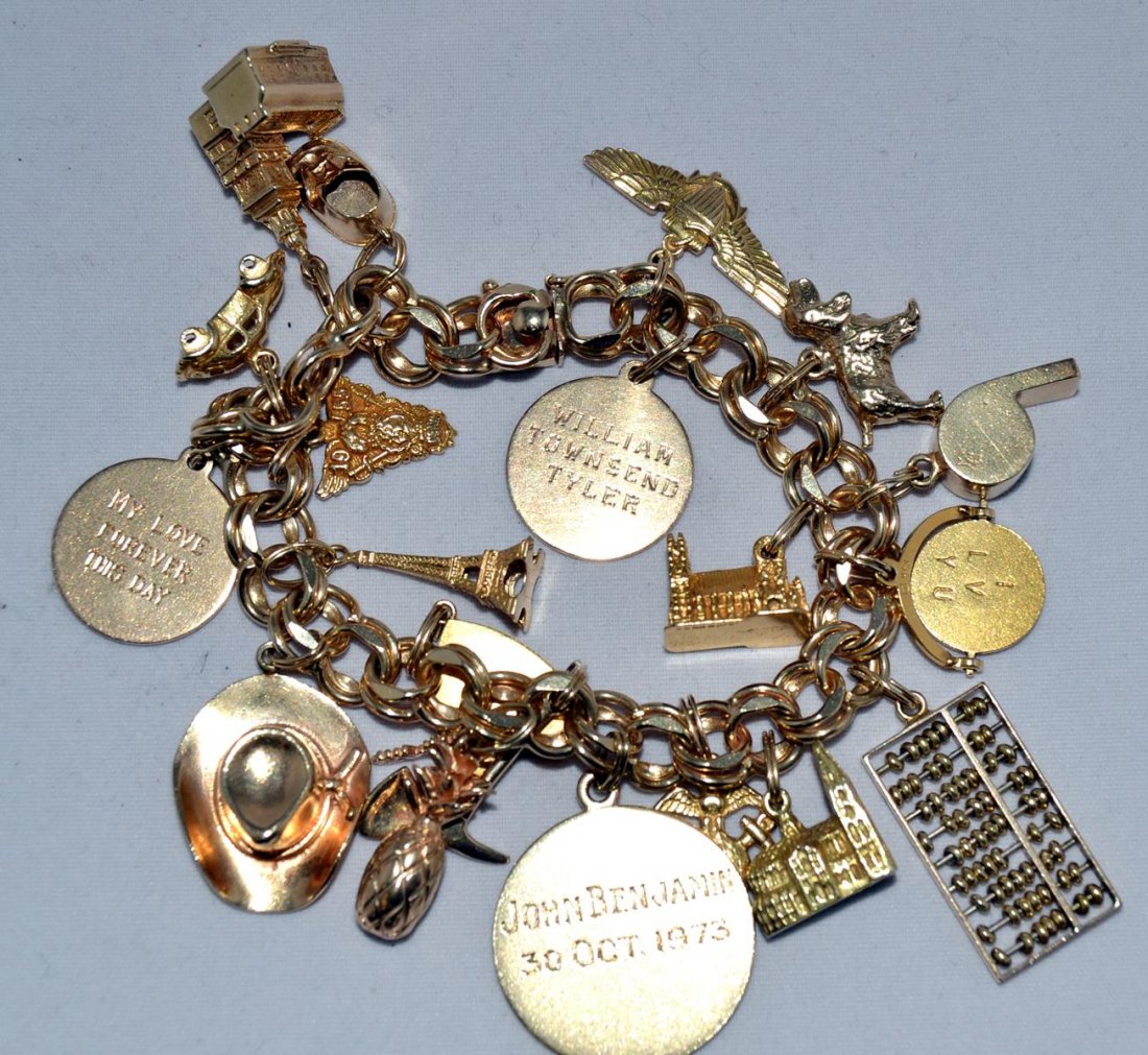 14K Heavy Double Link Charm Bracelet: 21 Charms including: abacus, whistle, Eiffel tower, cowboy hat, baby shoe, auto and more.