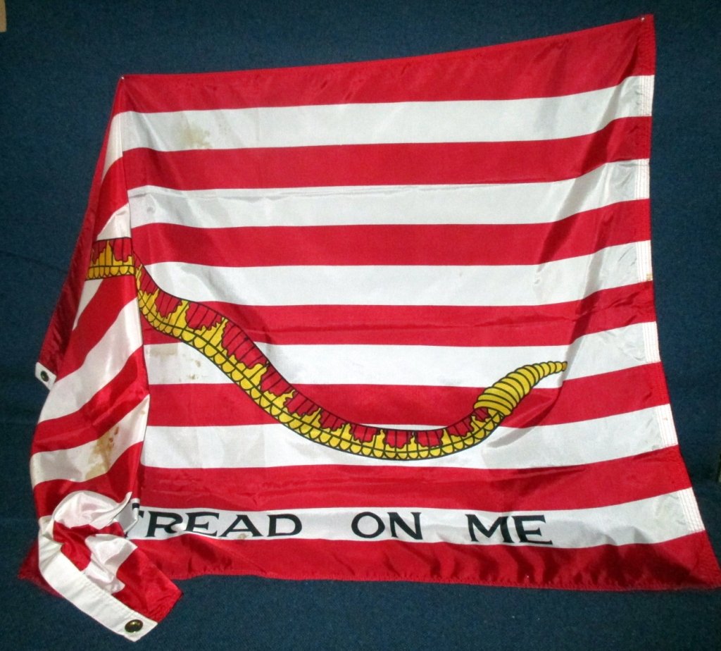 Don't Tread on Me Flag: 59" x 35". Some rust spots, cleaning tag.