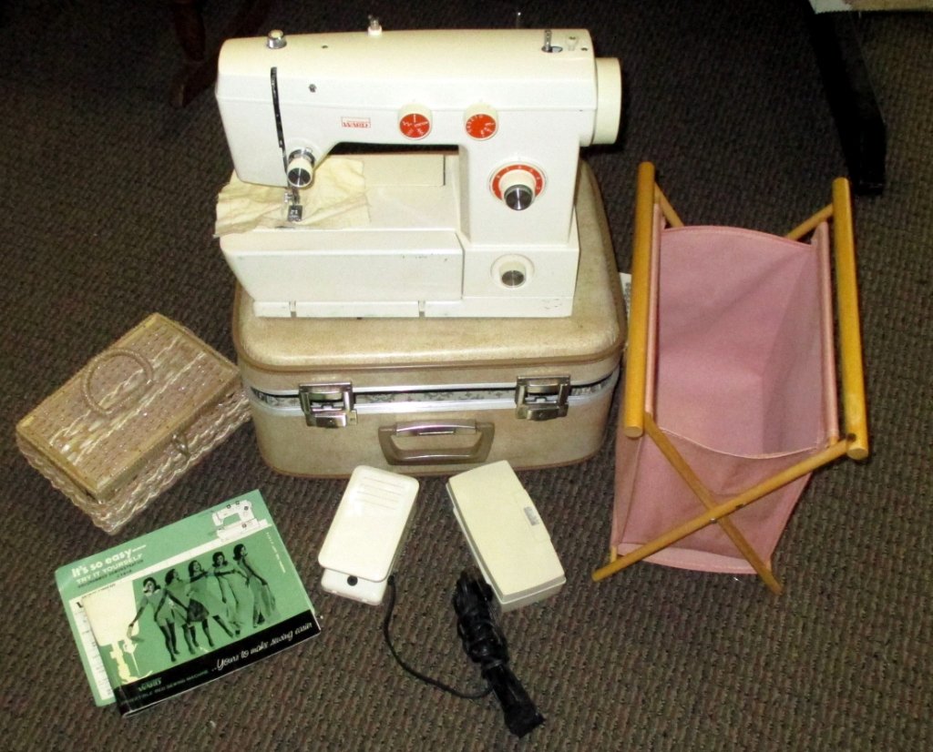 Montgomery Ward Portable Sewing Machine: W/manual, Model UHT J1414. Together w/sewing basket & notions. Machine needs work.