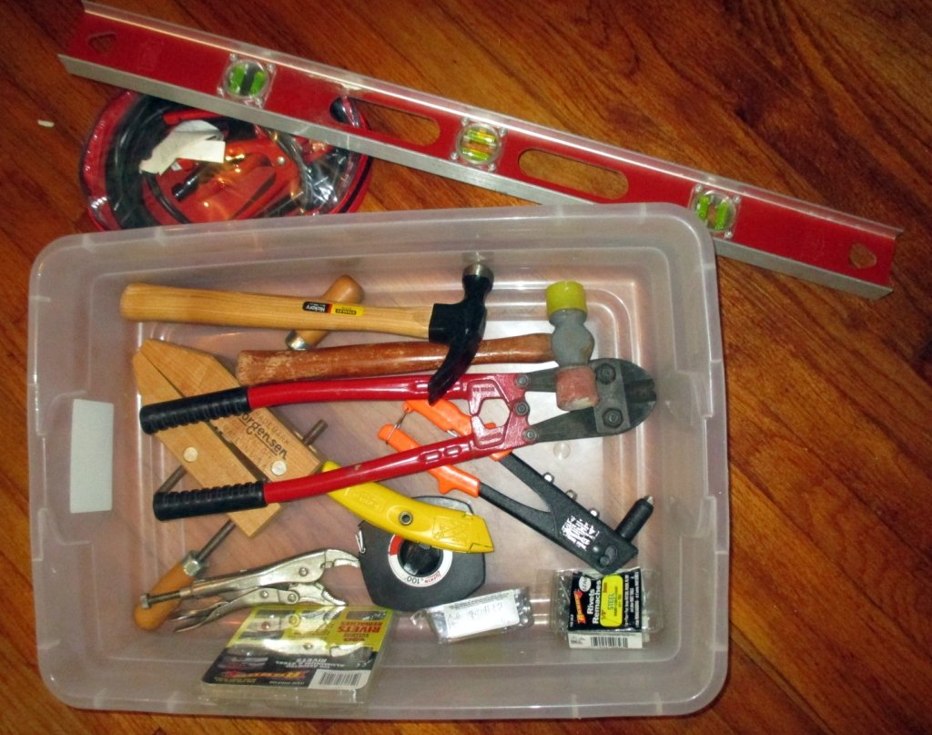 Hand Tool Lot: Inc. level, battery cables, pop rivets w/gun, bolt cutter, wood block clamp, 100' Lufkin tape, non-marring hammer, Stanley hammer & box cutter, vise grips.