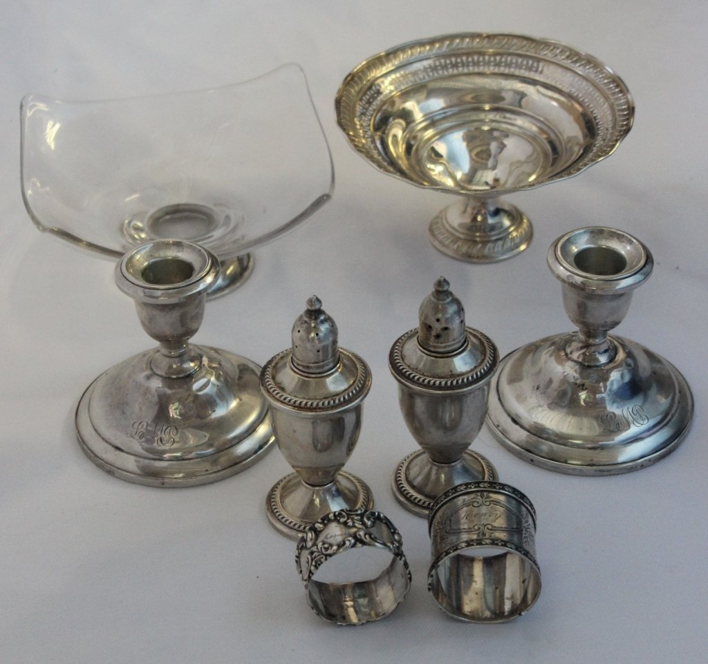 Sterling Silver Lot: Including: low compote, candle holders (some dents), salt/peppers, two napkin rings (2 troy, one unmarked but tested) & 5.75" glass dish w/sterling foot.