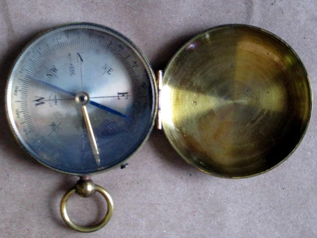 French Compass: Covered case with fob ring, lever to activate, marked Make in France, circa 1900, 2" diameter.