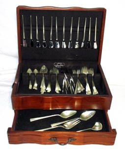 Reed & Barton Dimension Sterling Silver Flatware: Ronald Prip design: 13 dinner forks & knives; 10 salads; 11 teaspoons, place spoons & butters; 12 cocktail forks, 2 tablespoons (one slotted), sauce & gravy ladles in silver storage chest. 83 troy acc