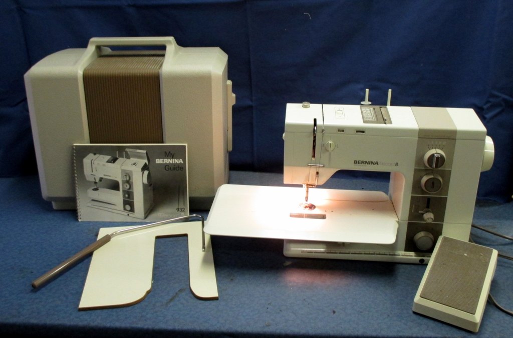 Bernina Portable Electronic 932 Sewing Machine: w/manual, knee press and wood inset. Good running condition.