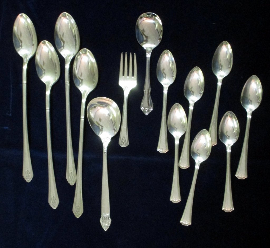 Silverplated Flatware inc. Demi-Tasse Spoons: 7 demi-tasse spoons, 4 iced tea spoons, sugar shell, baby fork and stainless baby spoon.