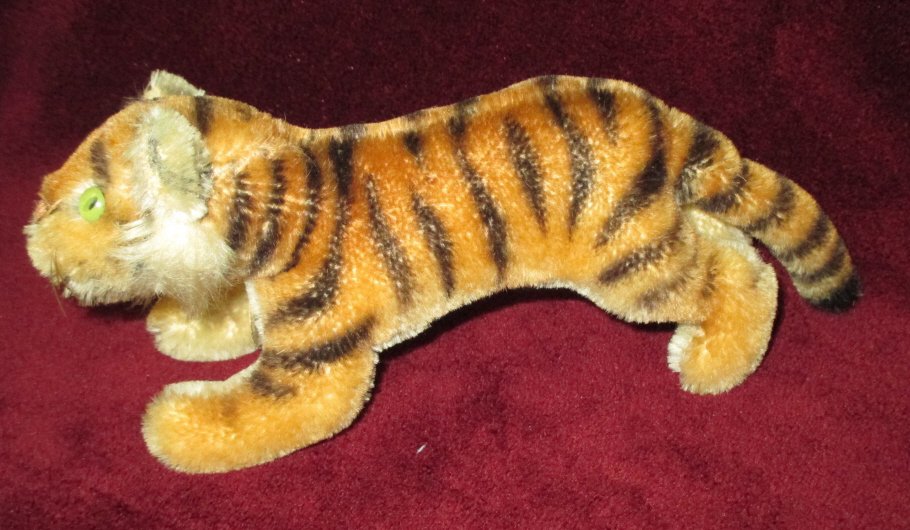 Little Steiff Crouching Mohair Tiger: 8" to end of tail, green eyes, no button/tag present.