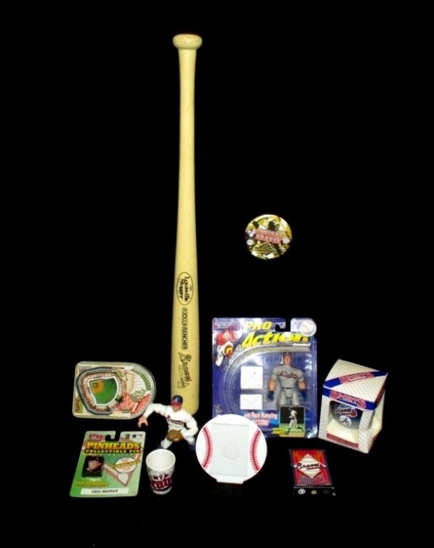 Braves Baseball Memorabilia: Inc. Pro Action Chipper Jones mint in package, playing cards, ornament, Maddux action figure, pins, jigger, tin and Louisville Slugger bat.