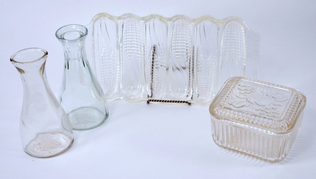 Vintage Glass Miracle Maize Corn Stick Pan Plus: 12" long corn stick pan well marked and decorated, together w/refrigerator jar with fruit top (has a chip), and two salad dressing measures. Expected wear.