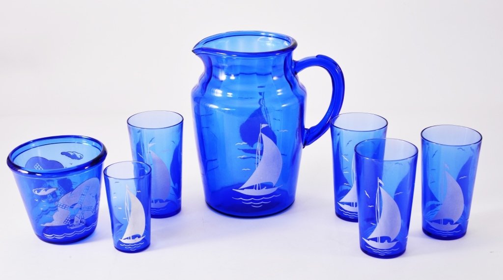 Ships/Sailboats Pitcher & Tumblers Plus: Blue and white pitcher & 5 tumblers (four 5" tall), together w/small windmill bucket. Hazel Atlas glass, late 1930s. Expected wear.