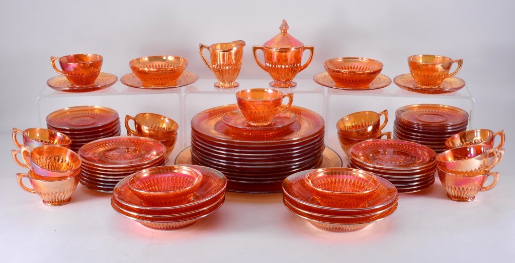 Iridescent Anniversary Glass Dinnerware: 80 pieces including cups and saucers, plates, cream and sugar, bowls. Jeannette Glass. Expected wear.