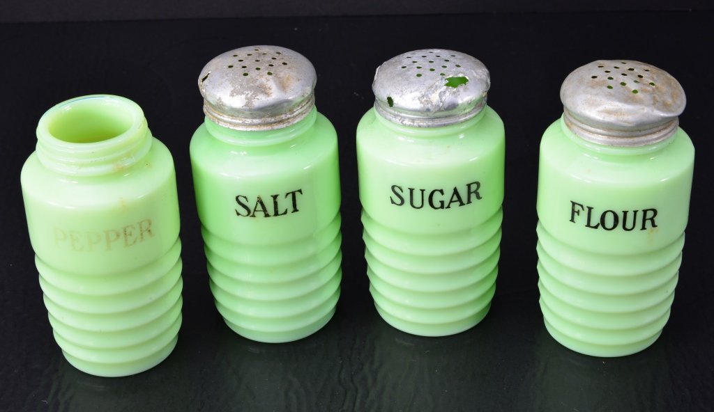 Vintage Green Glass Kitchen Shakers: 4.75" sugar, flour, salt, pepper, aluminum tops. One missing top. Expected wear.