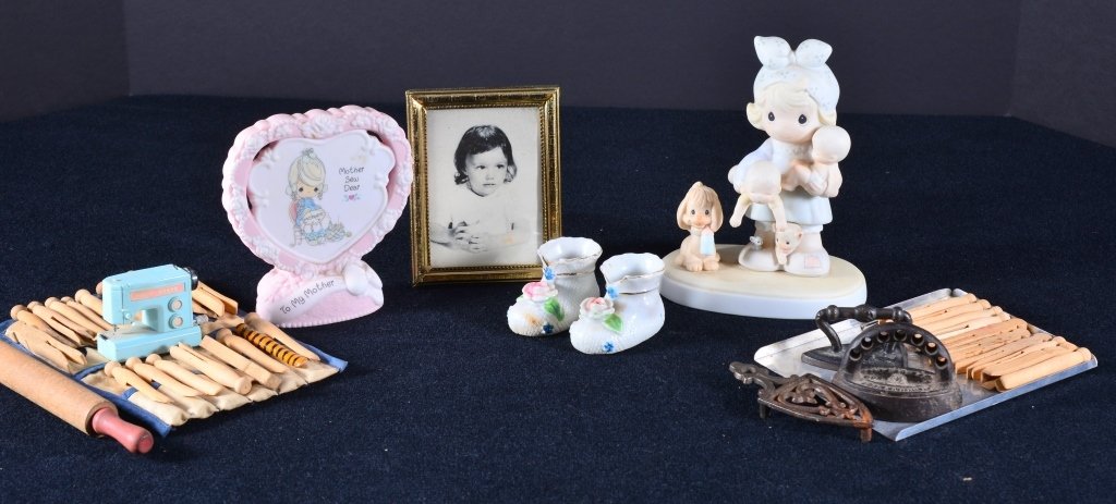 Childs Miniature Items, Precious Moments Plus: Two cast iron irons w/one trivet, plastic sewing machine, rolling pin, baking sheet, wooden clothes pins w/hanger, precious moments figurine "The Joy Of The Lord Is My Strength", ceramic booties marke