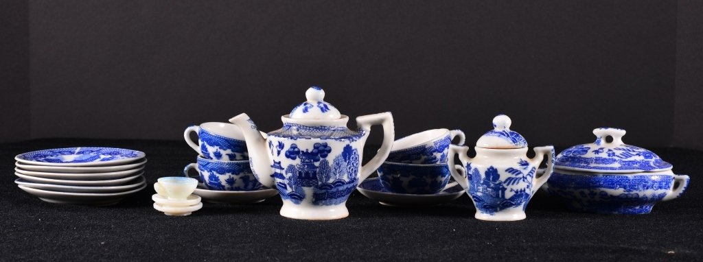 Oriental Children's Miniature Tea Set: Inc. tea pot (foot rim chip), covered sugar, cups, saucers, plates, covered casserole, (some marked Made in Japan).