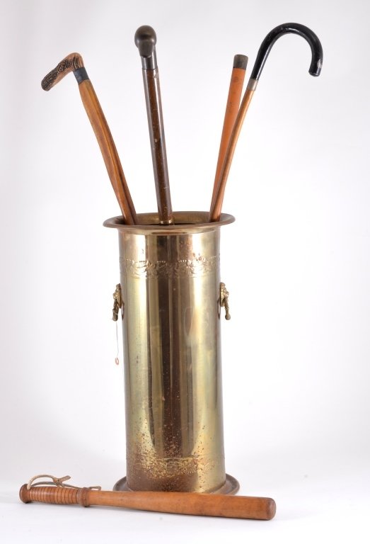Brass Cane Holder, Canes & Billy Club: 5 canes (brass duck head and bone handles) billy club 19" L and cane holder 9.5" D x 20" T.