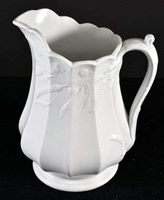 English Ironstone Pedestal Pitcher: Paneled body, C. Collinson & Co., 9.5" T, small age crack at lip.