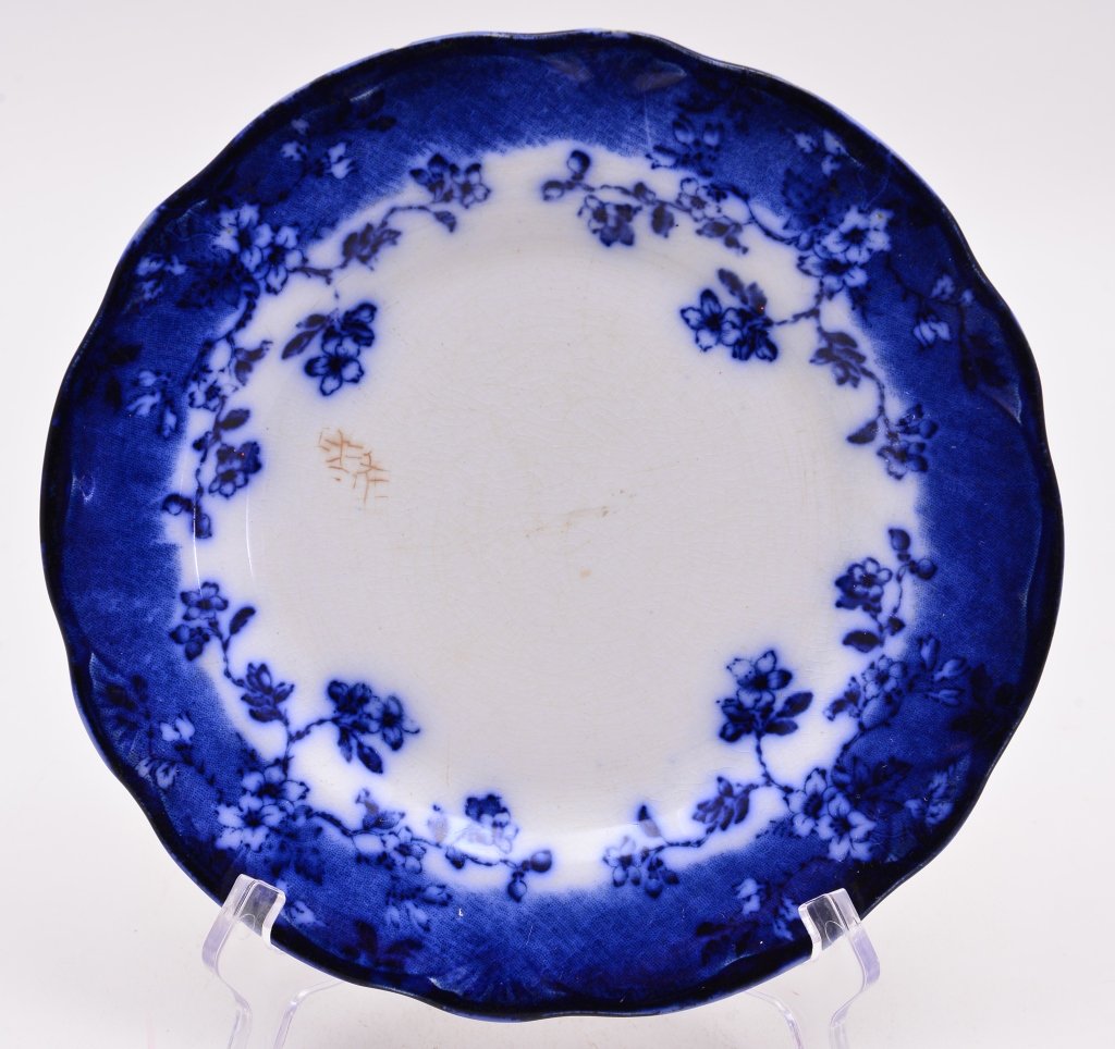 English Flow Blue Marked Semiporcelain Plate: Brun Swick, stamped mark, 9" D, under rim chips.