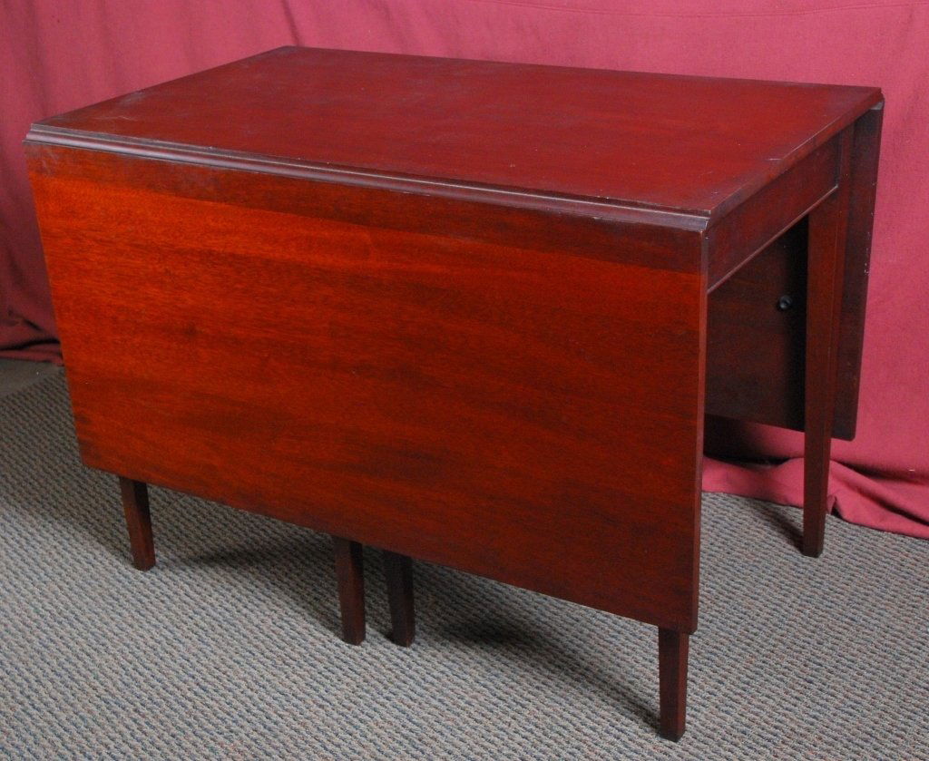 Drop Leaf Table: 42" x 24" plus 21" drops x . Top marred.