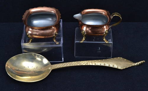 Footed Copper Cream & Sugar and Large Brass Spoon: Cream & Sugar 2" tall, spoon 13" long.
