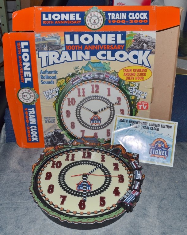 Lionel 100th Anniversary Train Clock: Authentic RR sounds, train revolves around clock every hour, light sensor turns sound off at night w/Certificate of Authenticity, battery operated, 2001.