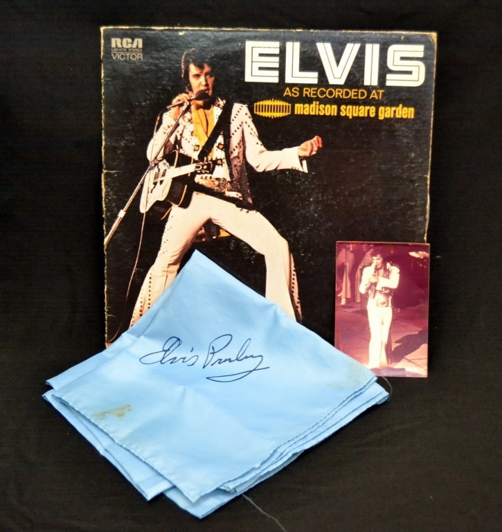 Elvis Presley Scarf, Photo and Album: The consignor, Karen Kelley, received the scarf printed with Elvis' signature and photo while running a gas station in Plant City, FL, the 33 record was recorded at Madison Square Garden.