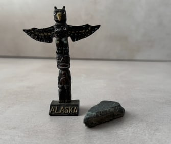 Vintage Alaskan Totem Pole souvenir with small triangular stone tool
