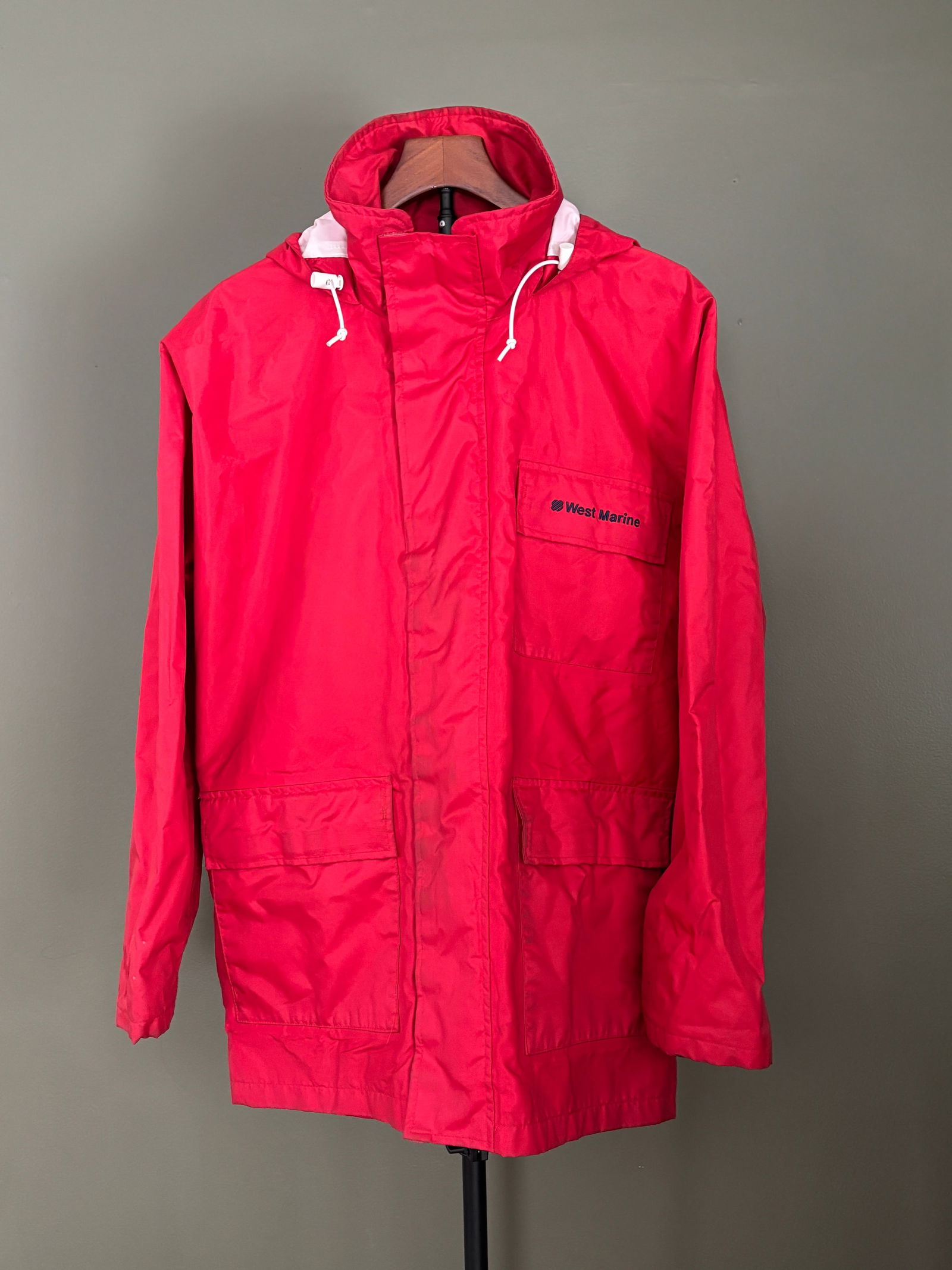 West Marine Nautical Gear Hooded Rain Jacket - Men's Large: West Marine Nautical Gear hooded rain jacket in bright red. Designed with a full-length front zipper and storm flap, adjustable hood with drawstrings, long sleeves, and multiple front patch pockets. F