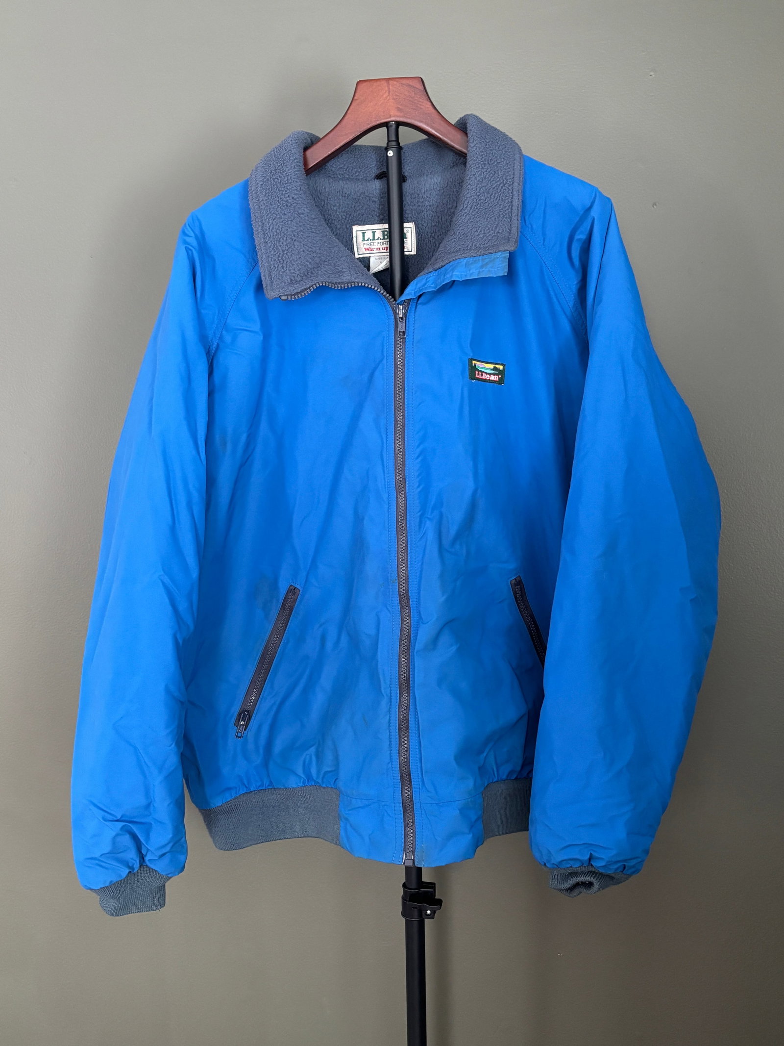 Vintage L.L. Bean Warm-Up Jacket, Freeport Maine, Men's XL Tall - Made in USA: L.L. Bean "Warm-Up Jacket" in bright blue with gray fleece lining. Full-zip front with stand collar, ribbed cuffs and hem, and zippered hand pockets. Interior fleece provides lightweight warmth.