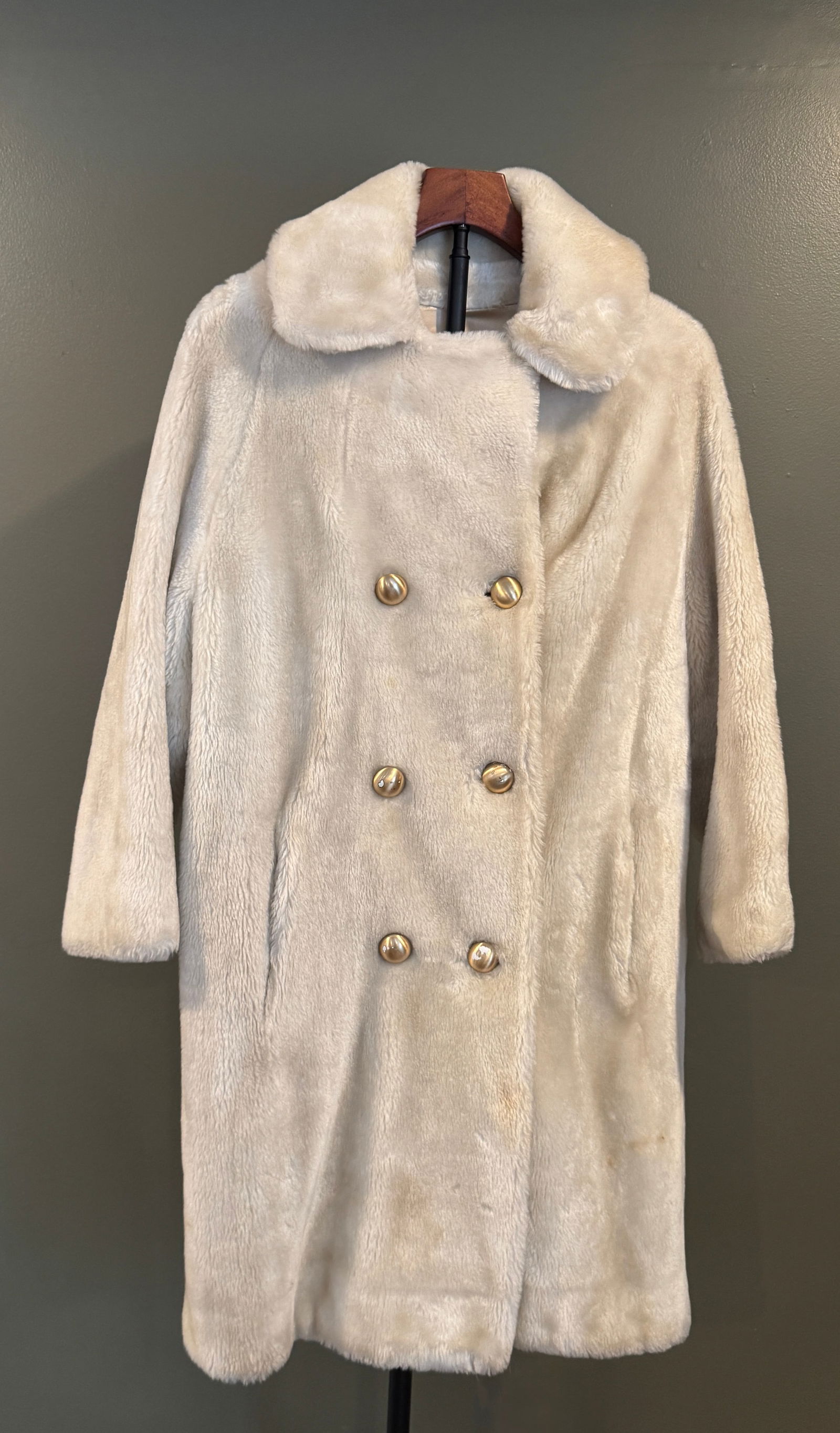 Vintage Ivory Faux Fur Women's Coat: Vintage women's coat in ivory faux fur, featuring a double-breasted front with gold-tone buttons and a wide notched collar. Classic mid- to late-20th-century styling with a soft, plush texture. Labele