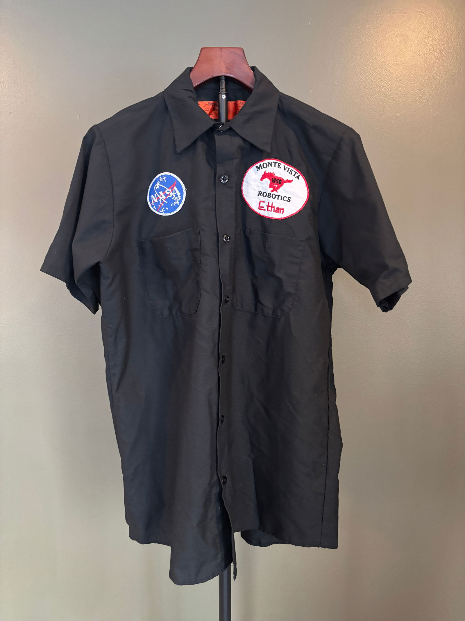 Red Kap Black Short-Sleeve Work Shirt with NASA Patch & Monte Vista Robotics Insignia, Size M: Classic black short-sleeve work shirt by Red Kap, featuring embroidered patches including a NASA "meatball" insignia and a Monte Vista Robotics name patch reading "Ethan." Button-front des