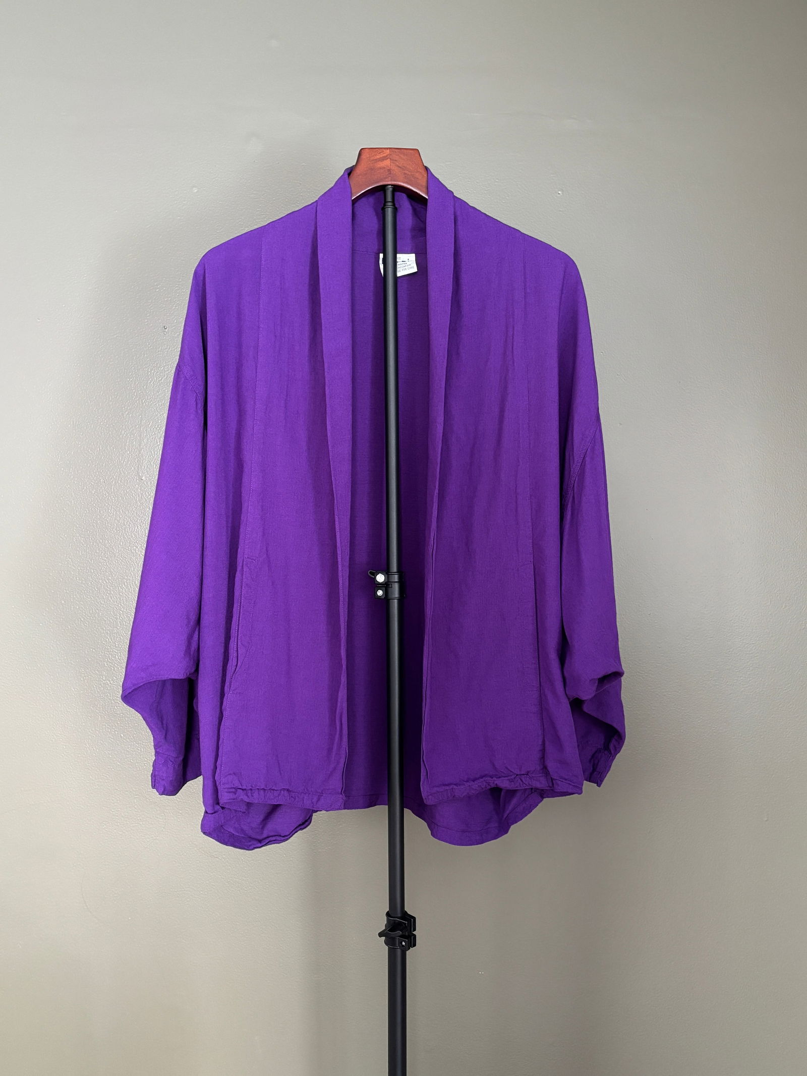 Vintage Thin Air Purple Rayon Open-Front Jacket, One Size: Vintage open-front jacket by Thimir in a saturated purple rayon. Designed with a relaxed, draped silhouette, wide collar, and fluid construction that layers easily over dresses or separates. Lightweig