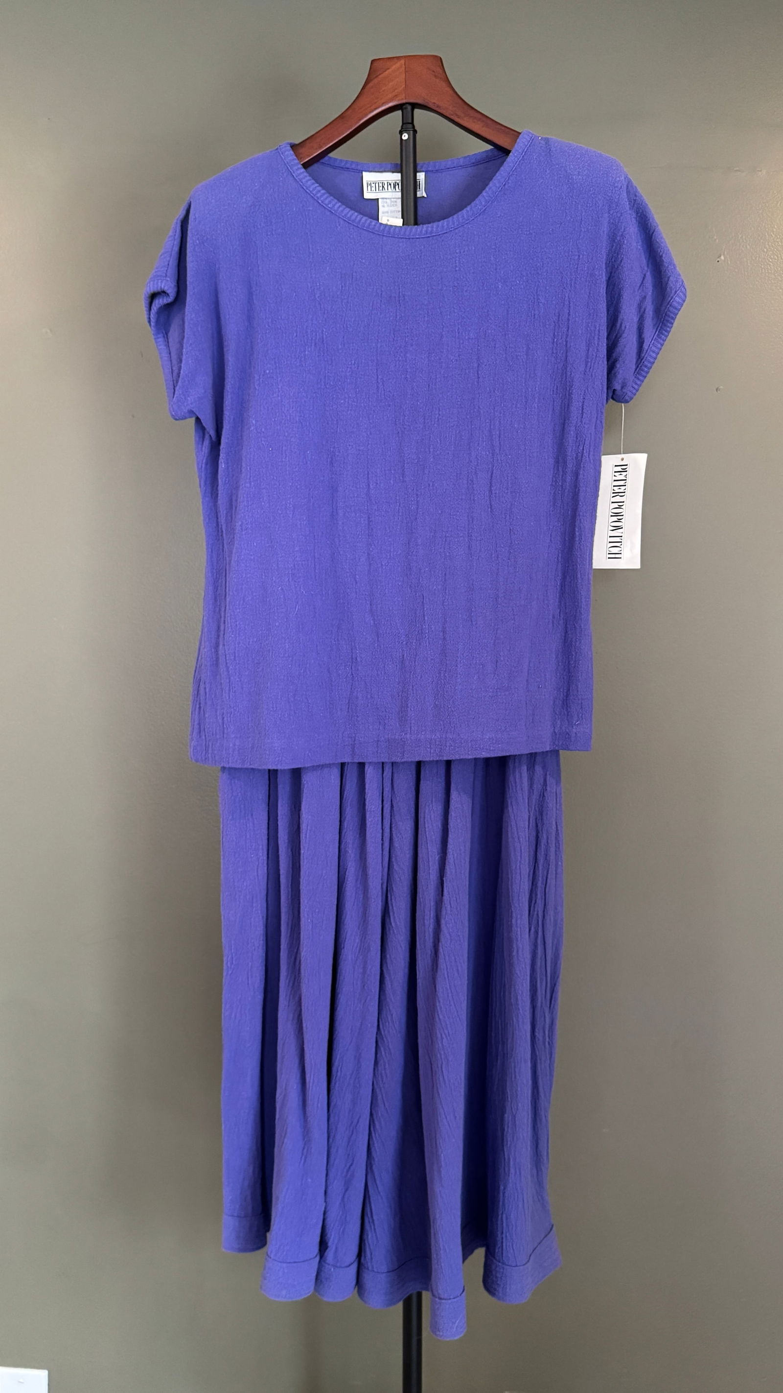 Peter Popovich Embroidered Cotton Shirt & Skirt Set, USA, Size Medium & Small: Vintage Peter Popovich two-piece set in textured purple cotton, consisting of a coordinating shirt and skirt. Both pieces feature delicate floral embroidery at the shoulders, a hallmark of Popovich's