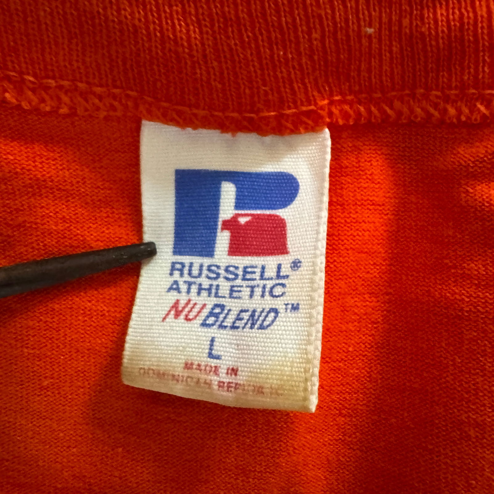 Collegiate Athletic Apparel Lot — Nike Dri-Fit & Russell Athletic, Size L: Three-piece collegiate-themed athletic lot featuring a navy Nike Dri-Fit sleeveless pullover with "Collegiate C" logo, an orange Russell Athletic NuBlend T-shirt with "Collegiate" letterin