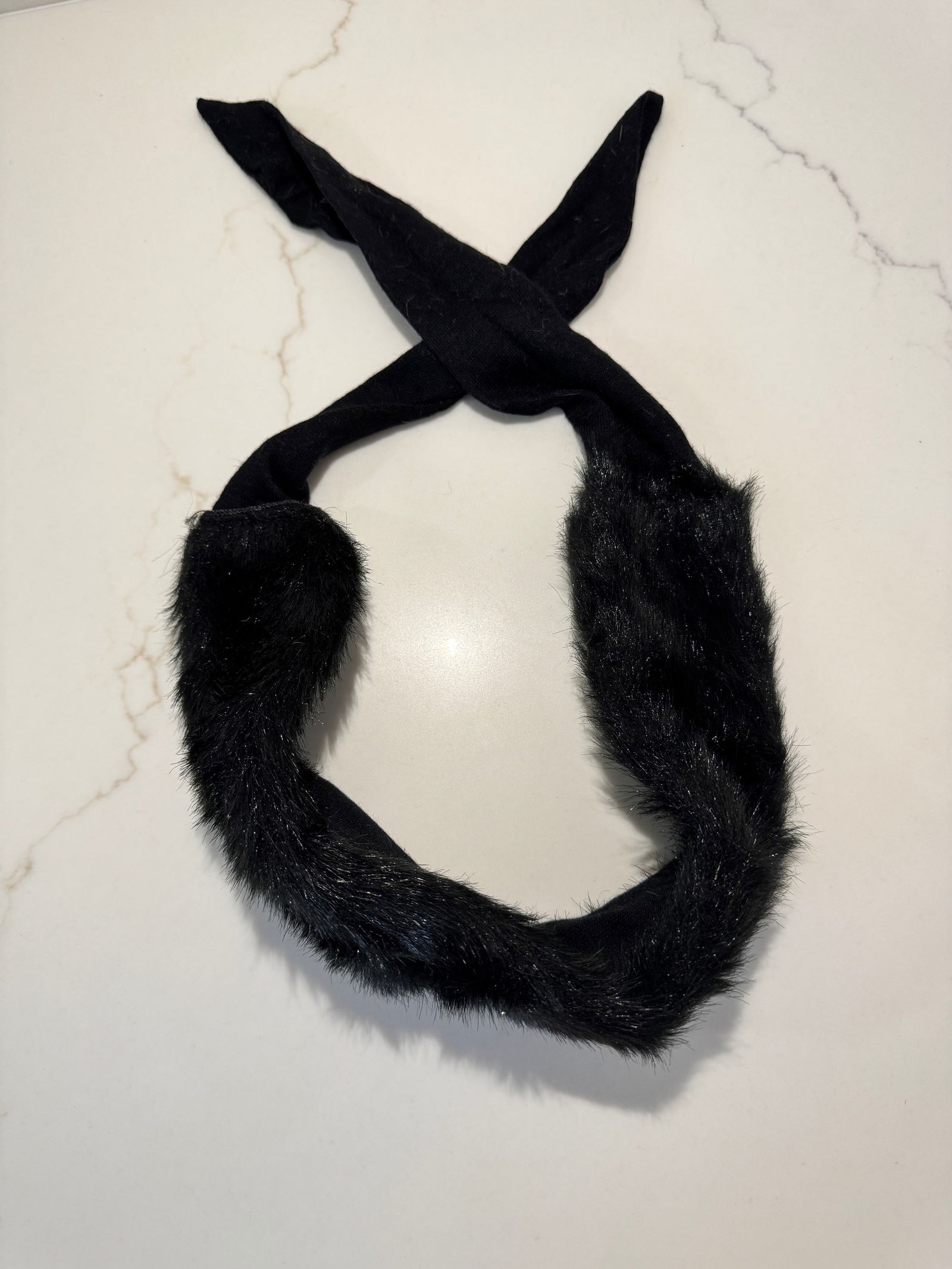 Vintage Black Fur-Trimmed Neck Scarf / Collar: A sleek vintage black neck scarf featuring a plush fur-trimmed collar with soft fabric ties. Minimal and sculptural in form, designed to drape gracefully at the neckline for understated cold-weather e