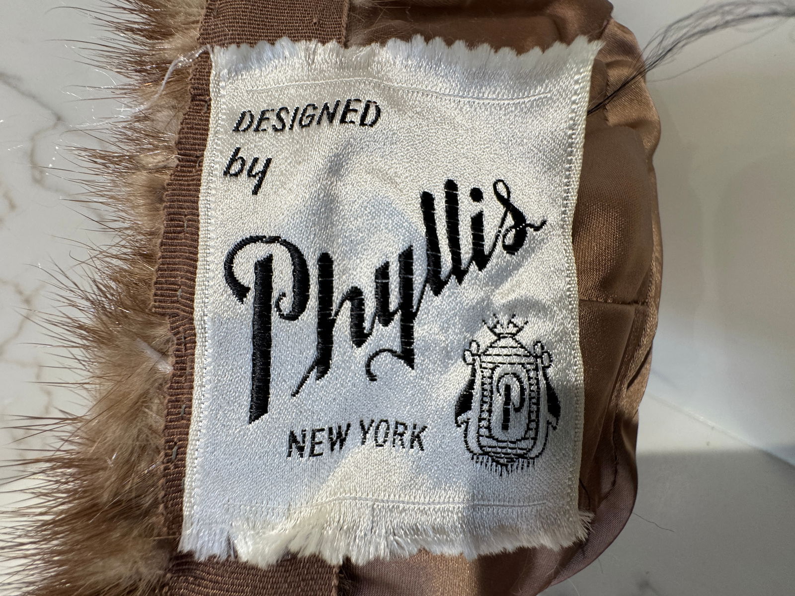 Mr. John "Empress" Cream Fur Hat, Made in Italy: A vintage cream-toned fur hat by Mr. John, labeled "Empress", with tags noting New York and Paris and marked Made in Italy. The hat features a softly sculpted crown with dense, plush fur and a c