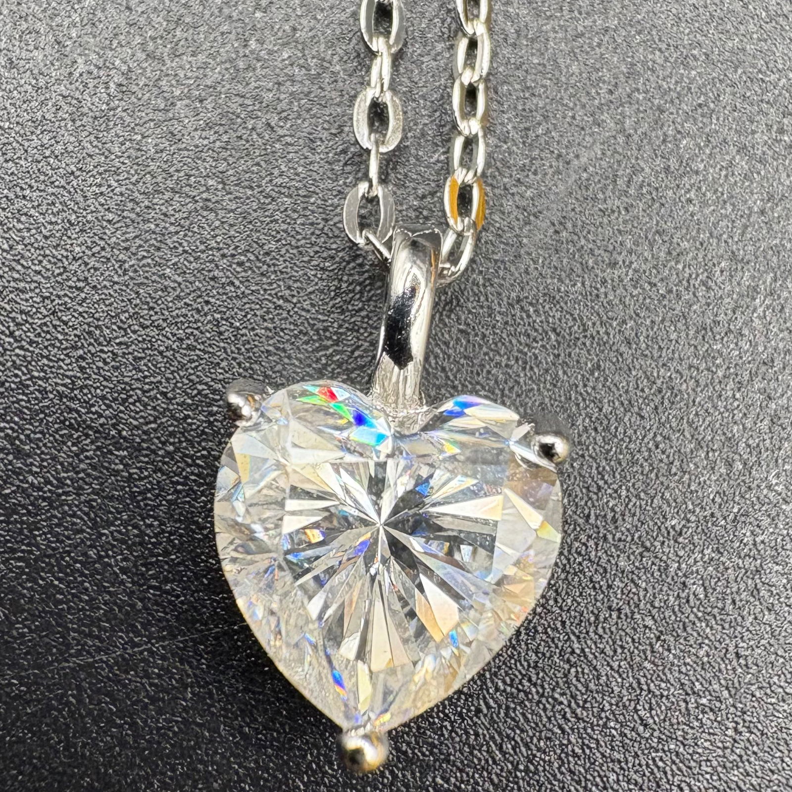 Heart Cut 2CT Moissanite Solitaire S925 White Gold Plated Necklace: This sophisticated trilogy-style ring is masterfully crafted in S925 sterling silver and finished with a premium white gold plating for a radiant, high-luster shine. The design features a brilliant 1-