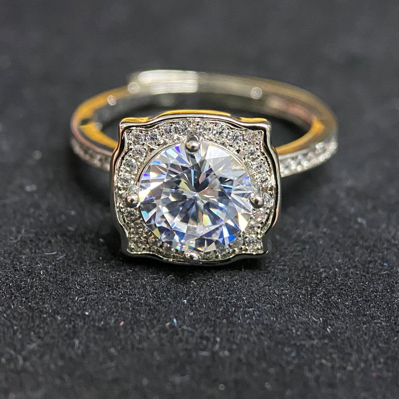 Round Brilliant Cut Solitaire Ring: A classic and timeless solitaire ring featuring a 2.0-carat round brilliant-cut center stone. The gem is held by a traditional six-prong setting, specifically designed to elevate the stone and maximiz