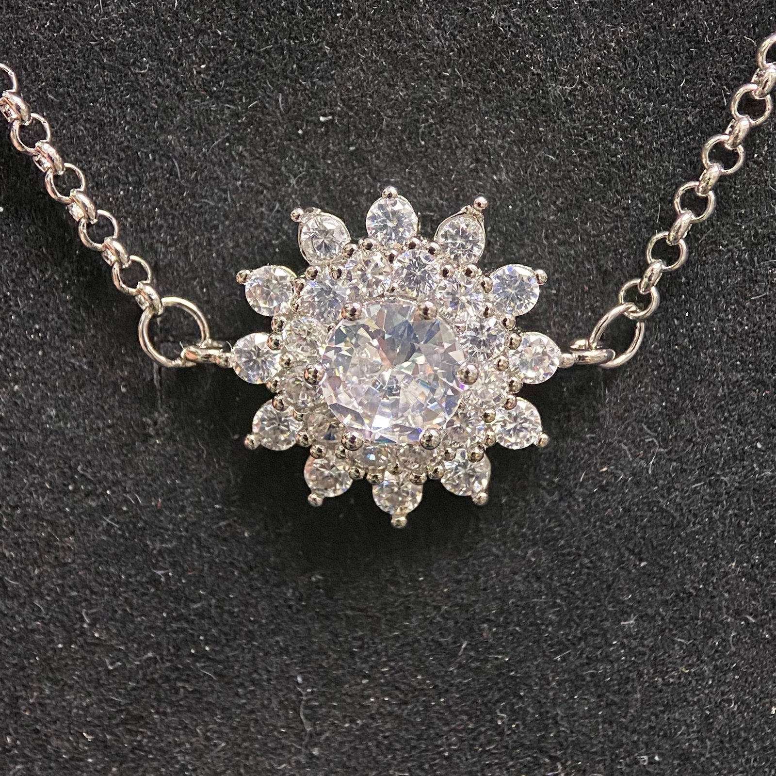 Round Brilliant Cut Solitaire Stud Earrings: A pair of elegant and essential stud earrings, each featuring a 0.5-carat round brilliant-cut center stone. The gems are securely held in a classic four-prong white metal setting, specifically designe