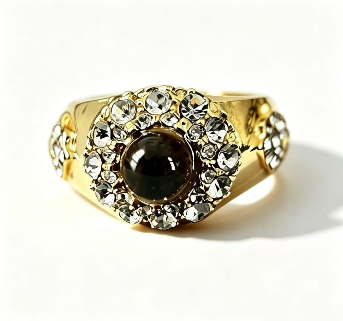 Black Agate Gold-Gilded Ring: Ring featuring a black agate center accented with decorative clear stone details and gold-gilded finish. Elegant ornamental design.
