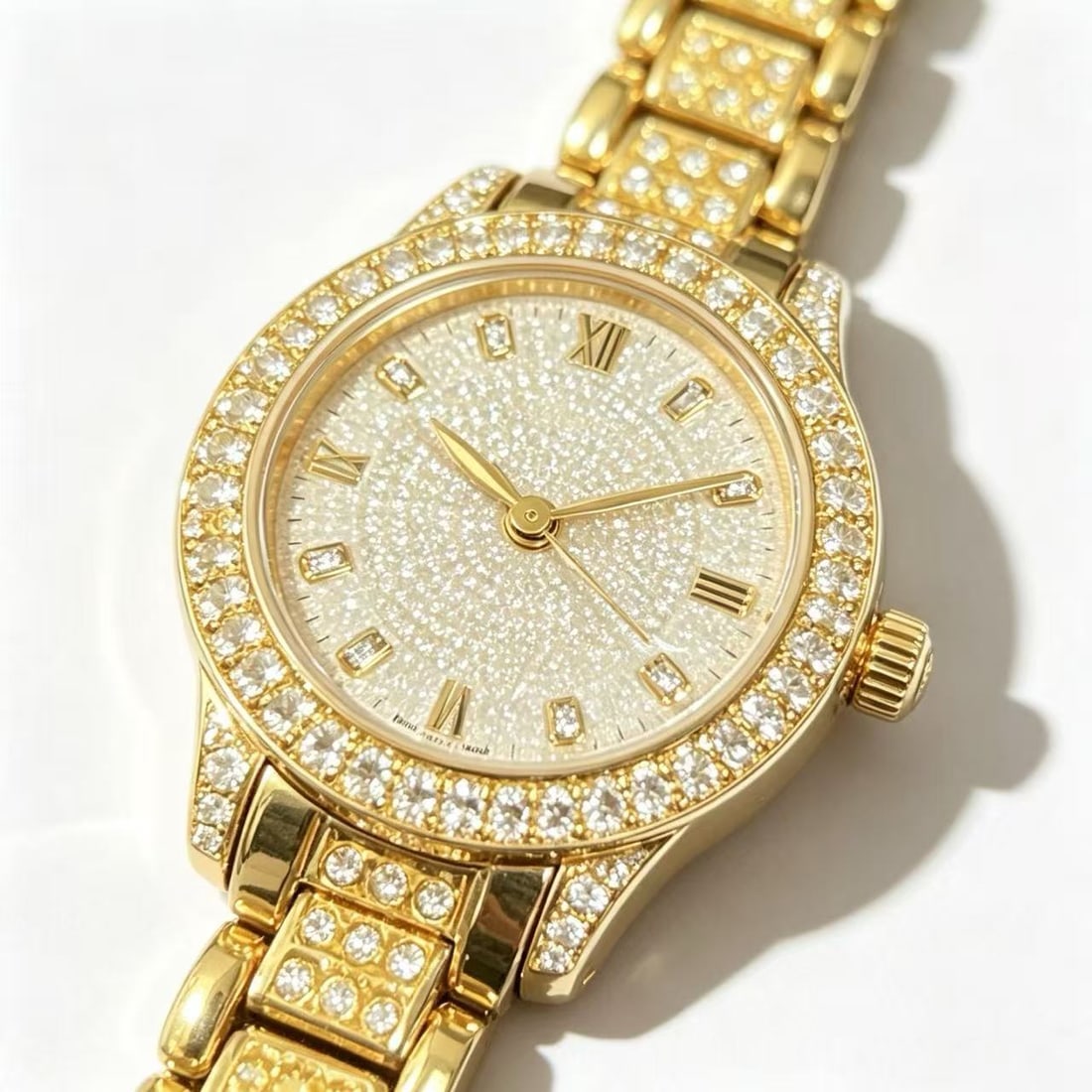 Moissanite Gold-Gilded Wristwatch: Decorative wristwatch featuring moissanite accents throughout the bezel, dial, and bracelet with gold-gilded finish. Roman numeral markers and ornamental luxury-inspired design.