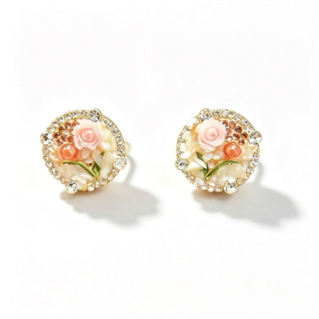 Resin Rose and Mother-of-Pearl Gold-Gilded Earrings: Pair of earrings featuring resin rose details, mother-of-pearl elements, and decorative rhinestone accents with gold-gilded finish. Floral-inspired ornamental design.