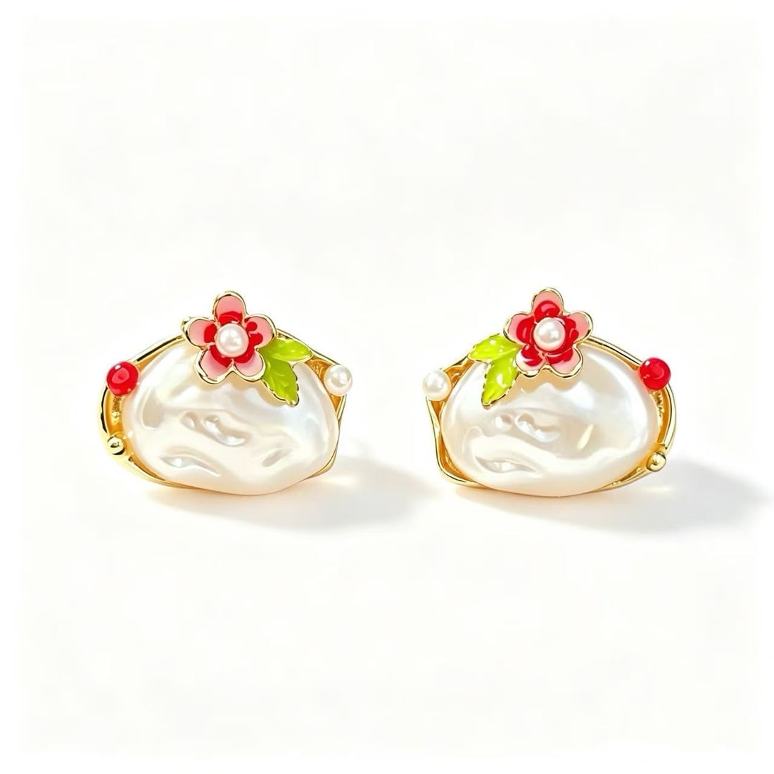 Baroque Pearl Gold-Gilded Floral Earrings: Pair of earrings featuring baroque pearl elements accented with floral decorative motifs and gold-gilded finish. Elegant contemporary design.