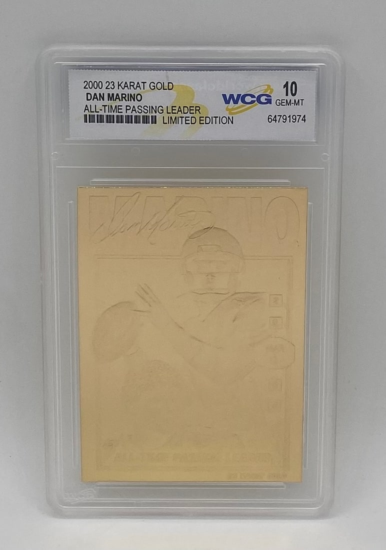 2000 23 Karat Gold Dan Marino All-Time Passing Leader WCG 10 Gem Mint: Single-card lot featuring Miami Dolphins Hall of Famer Dan Marino. 2000 23 Karat Gold Limited Edition insert celebrating his status as the All-Time Passing Leader. Encased and graded WCG 10 Gem Mint.